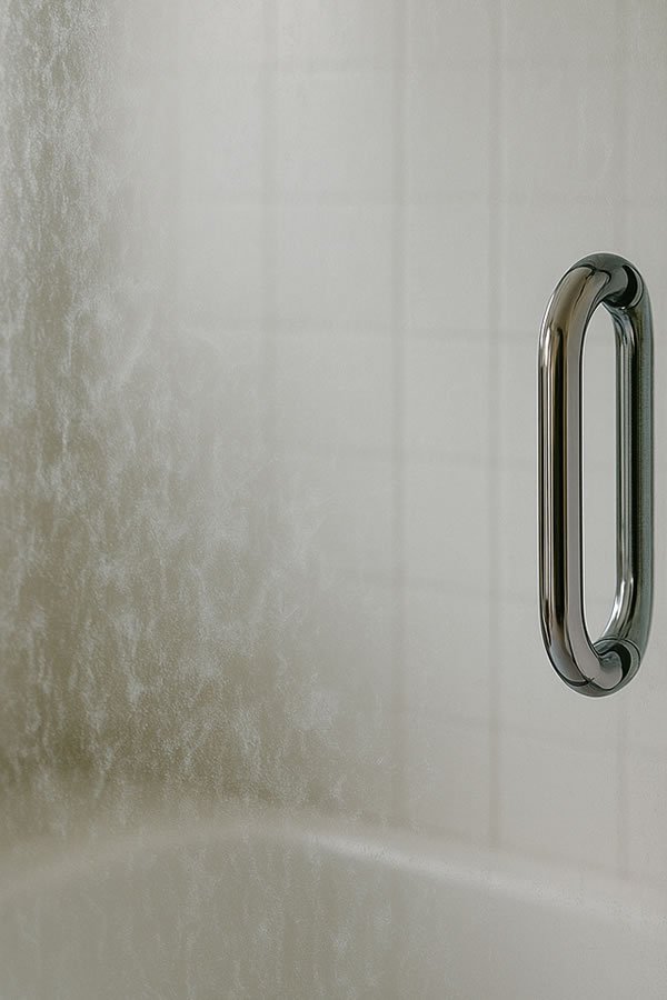 Hard water stains on shower door